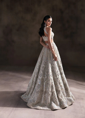 Ivory Halter Neck Bridal Lehnga Choli with Intricate Embellishments