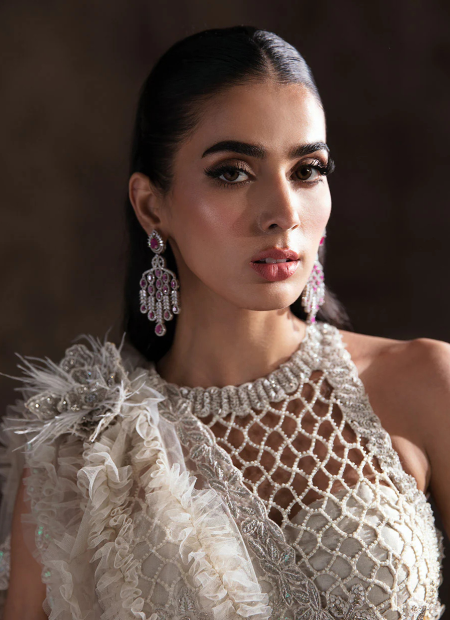 Ivory Halter Neck Bridal Lehnga Choli with Intricate Embellishments