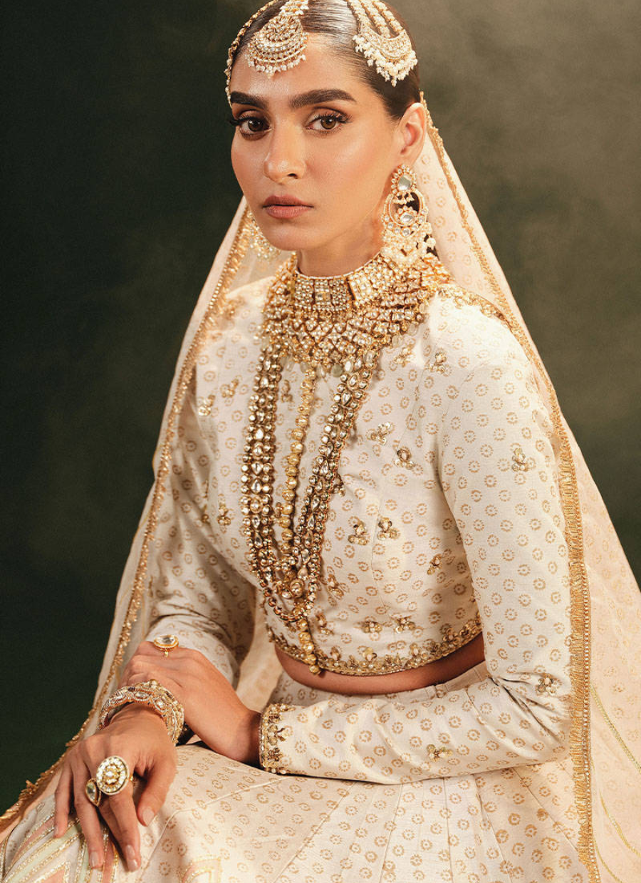 16 Ivory Bridal Lehenga with Geometric Patterns and Traditional Red Dupatta